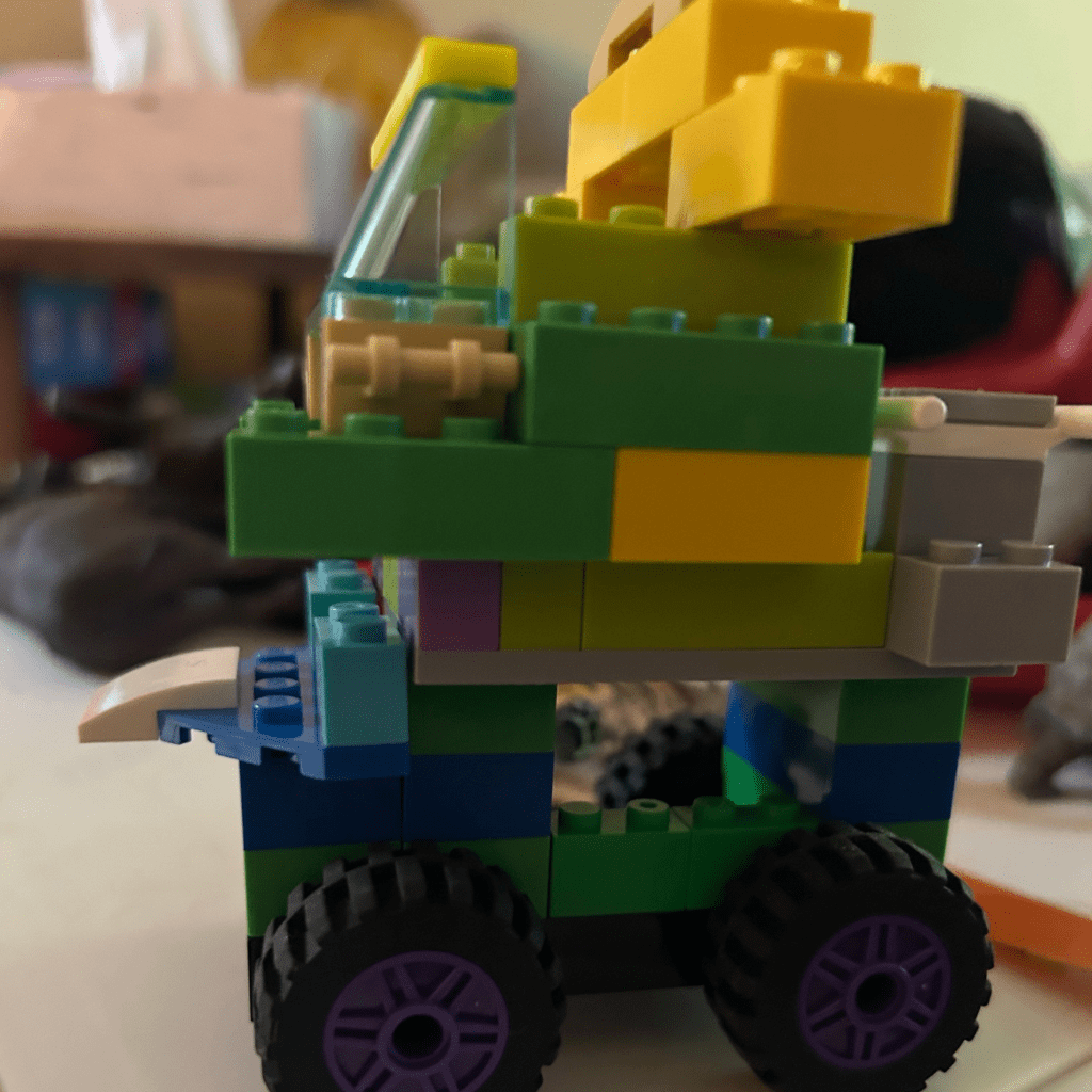 pic of my attempt at a lego "dreamhouse car" a la "Escape" (Bluey- Season 2, Episode 21). No butler, just a Lego Hulk.