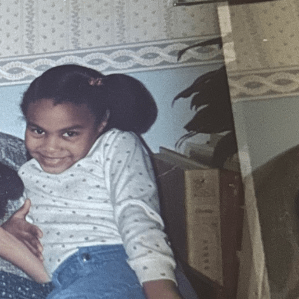 pic of 7-8 year old me, posing hard on sofa in old house in Columbia, MD